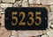 A Soild Polish Black Granite Oval Address Plaque with Gold Lettering